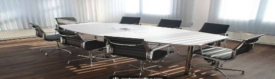 contemporary office chair, focused, slowly rotating, photorealistic, across a freshly refurbished office space, highly detailed, soft leather texture, 8K resolution, stark white, high-key lighting, shot with a macro lens.