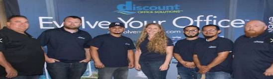 office waiting area, relaxed, people waiting and reading, photorealistic, art pieces on walls, highly detailed, soft music audible, 6K resolution, earth tones, gentle diffused light, shot with a 35mm lens.