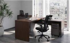 office workstation, organized, actively used by professionals, photorealistic, in a collaborative environment, highly detailed, screen reflections and notepads, 8K resolution, metallic greys, fluorescent lighting, shot with a 50mm lens.